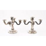 A pair of foreign silver five light table candelabra,