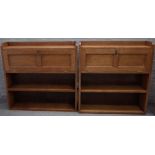 A near pair of oak Arts & Crafts floor standing bookcases,