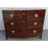 A Regency mahogany bowfront chest of three long graduated drawers on splayed bracket feet,