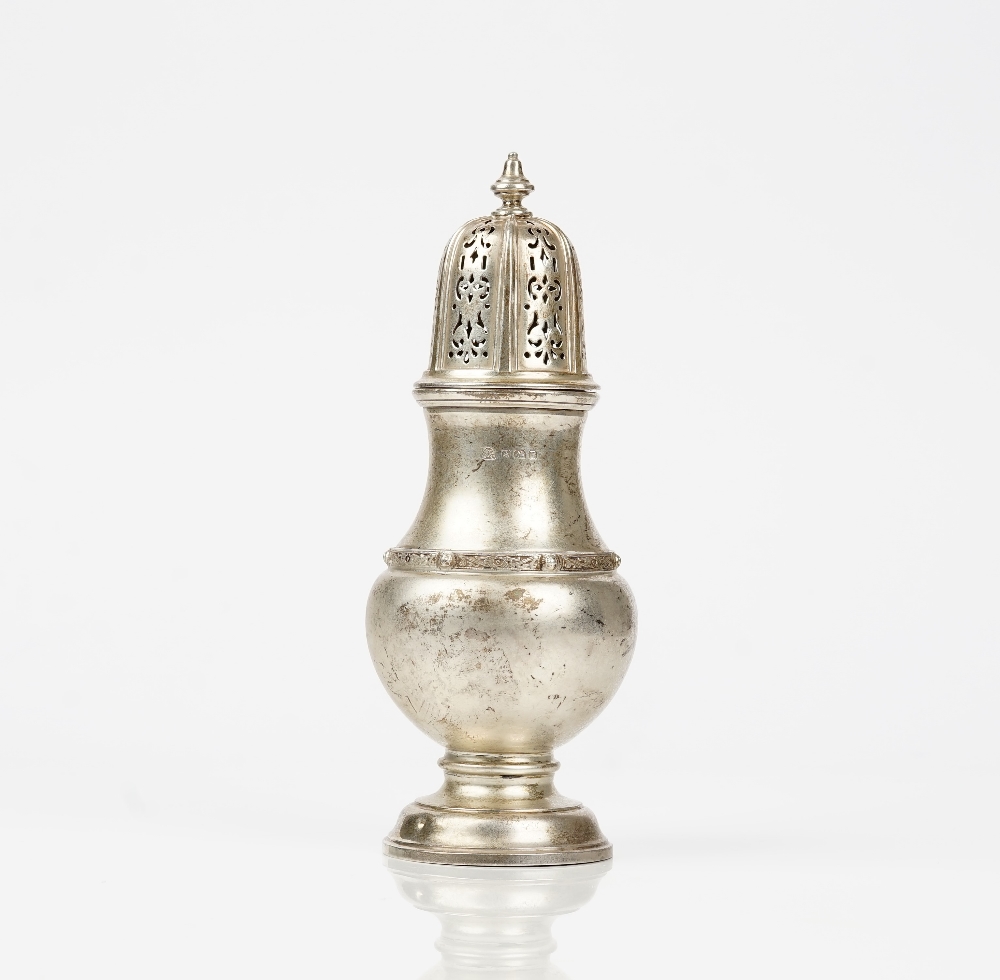 A silver sugar caster, decorated with a Celtic style band, raised on a circular foot,