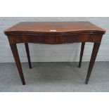 A George III satinwood banded mahogany serpentine card table, with dished gaming wells,
