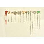 A collection of fifteen hat and stick pins including, a shell cameo,