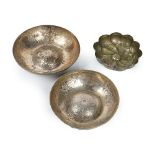Three Ottoman silvered metal repoussé Hamman bowls, 19th century, one with gadrooned body,