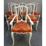 A set of twelve glossy white finish dining chairs, with pierced splats,