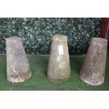 A set of three conical staddle stone bases, each 64cm high, (3).