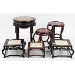 A group of six Chinese circular of square wood stands, 19th/20th century,