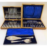 A walnut cased set of twelve pairs of plated mother of pearl handled dessert or fruit knives and