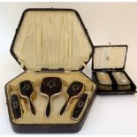 A silver mounted and tortoiseshell part dressing set,