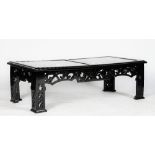 A black high gloss rectangular low cocktail table, in Chinese style, with fretwork friezes and legs,