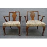 A pair of mid-20th century child's walnut open armchairs, of George I design, 57cm wide x 66cm high,