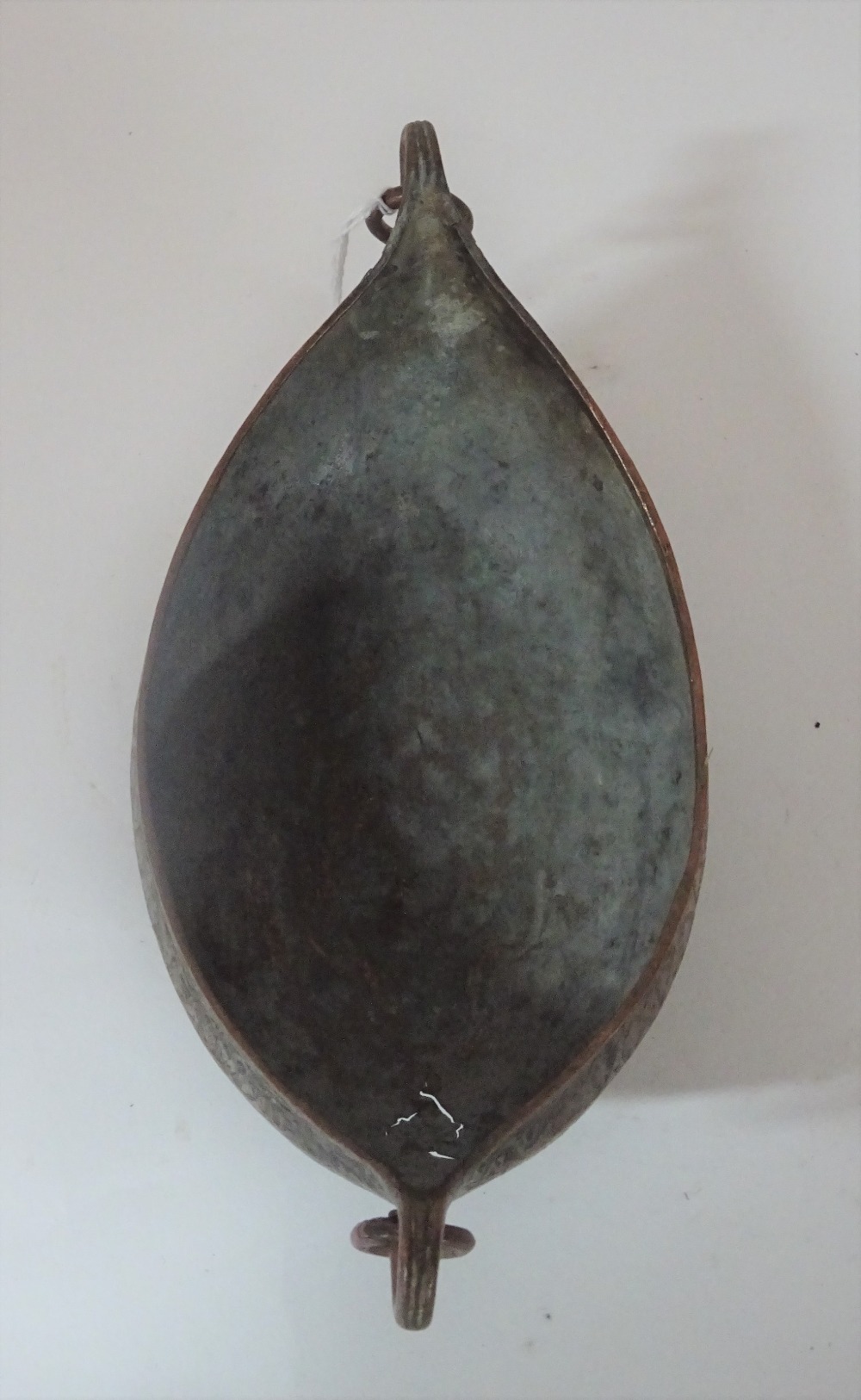 A Safavid tinned copper kachkol, possibly 18th century, of boat shape with ring handles, - Image 3 of 5