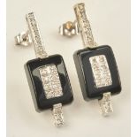 A pair of 18ct white gold, diamond and black onyx earrings,