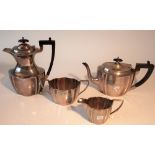 A silver four piece tea set, each piece of panelled oval form,