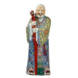 A large Chinese famille-rose figure of a monk, 20th century,