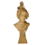 An Art Nouveau painted terracotta portrait bust inscribed 'La Pensee', 55cm high.