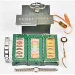 A lady's Gucci steel bangle wristwatch, with a warranty card and a booklet, with a Gucci case,