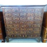 A Chinese hardwood apothecary chest with seven rows of five short drawers,