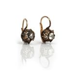 A pair of gold and silver set rose diamond single stone earrings,