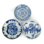 A Chinese blue and white dish, 19th century, painted with a dragon pursuing a flaming pearl,