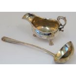 A silver rat tail pattern soup ladle, London 1901, weight 270 gms and a plated sauceboat,