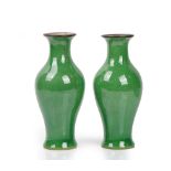 A pair of Chinese green-ground crackle glazed vases of slender baluster form, 24.5cm high, (2).