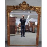 A 19th century French overmantel mirror, with cartouche crest over leaf moulded frame,