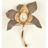 A baroque cultured pearl, gold, oxidised precious metal and diamond set brooch of flower design,