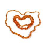 An amber necklace, formed of faceted oval and circular beads,