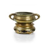 A Chinese polished bronze two-handled censer and stand, six character Xuande mark but later,
