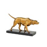 A gilded spelter model of a retriever, mounted on a black marble base, 29cm wide.