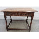 A 17th century oak plank top side table,