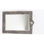 A late Victorian silver mounted shaped rectangular large strut backed mirror,