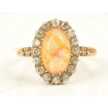 A gold, water opal and diamond set oval cluster ring,