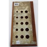 A silver mounted mahogany stand to measure the sizes of 15 differing cigars and with a 10 inch