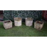 A pair of reconstituted stone octagonal planters, 53cm wide x 40cm high,