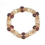 A gold and carbuncle garnet collar necklace, of reconstructed form,