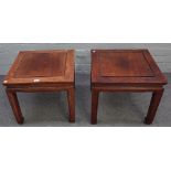 A pair of early 20th century Chinese hardwood square occasional tables on block supports,