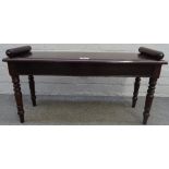 A 19th century mahogany window seat, with turned end stops and supports, 95cm wide x 48cm high.