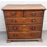 An 18th century oak chest of two short and three long graduated drawers on square bracket feet,