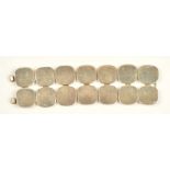 A silver bracelet formed as two rows of curved squares, on a twin hook shaped clasp,