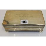 A rectangular silver cigarette box, Asprey, London 1914, with solid hinged cover, gilt lined,