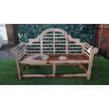 A Lutyens design teak framed hardwood garden bench, 165cm wide x 104cm high.