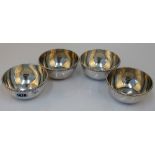 A set of four Egyptian circular bowls, each monogram engraved below a beaded rim, diameter 11.