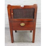 A George III mahogany tray top night commode, with tambour panel over pull-out, on square supports,