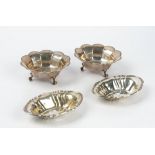 A pair of silver bonbon bowls, each of shaped circular panelled form,