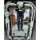 A Continental wall mirror, relief resin moulded with tulips, 60cm wide x 83cm high.