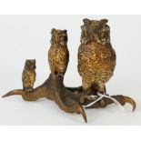 An Austrian cold painted bronze inkwell, naturalistically modelled as three owls perched on a talon,