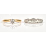 A platinum and diamond set half eternity ring, mounted with two rows of circular cut diamonds,