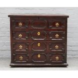 A Queen Anne oak chest, the lift top revealing a candle box and short drawer fitted interior,