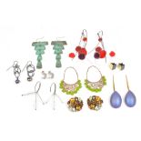 A collection of nine pairs of mostly costume earrings and earclips in a variety of designs, (9).